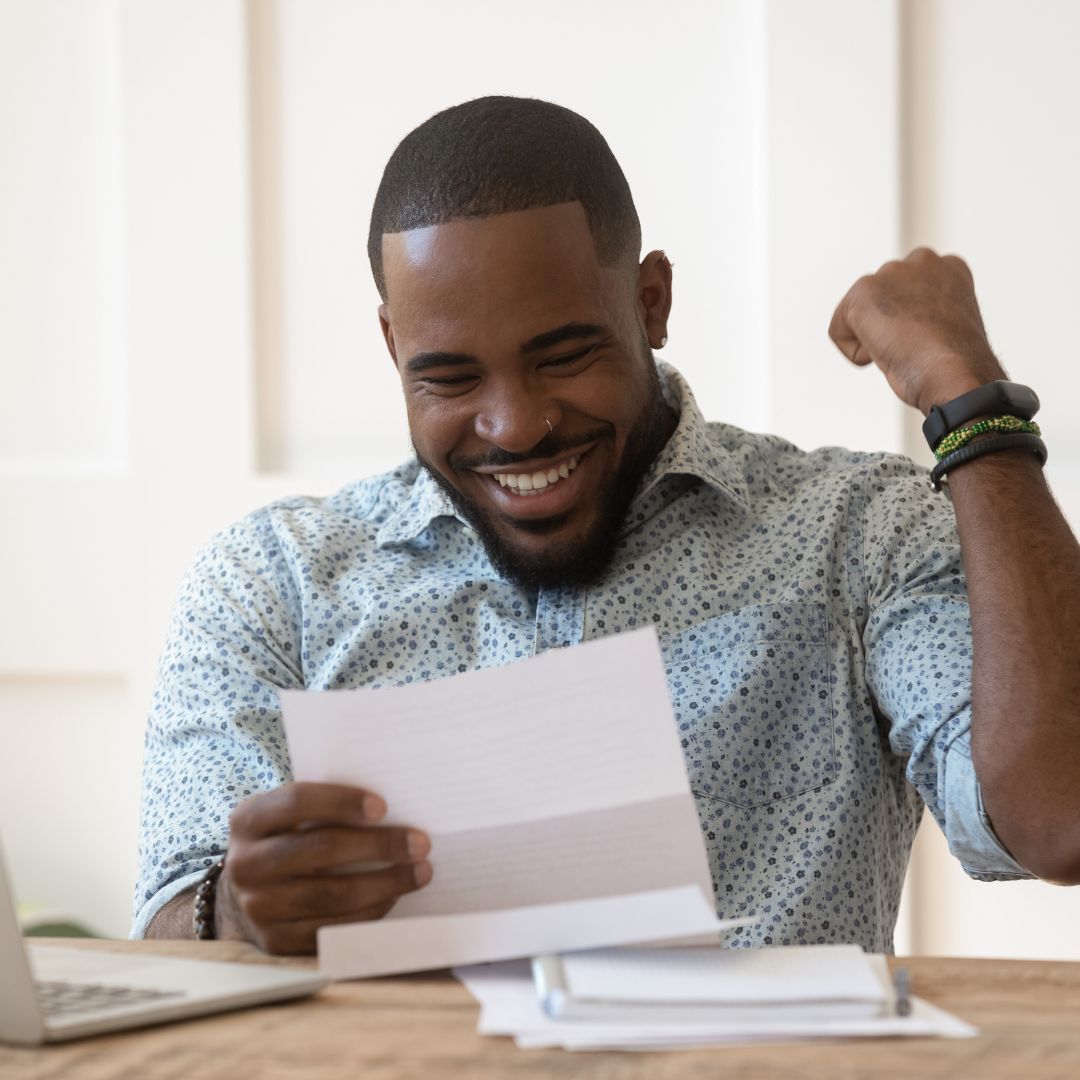 a man looking at his pre-approval letter